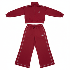 Alo Yoga crimson red 2-piece tracksuit set flat lay on white background